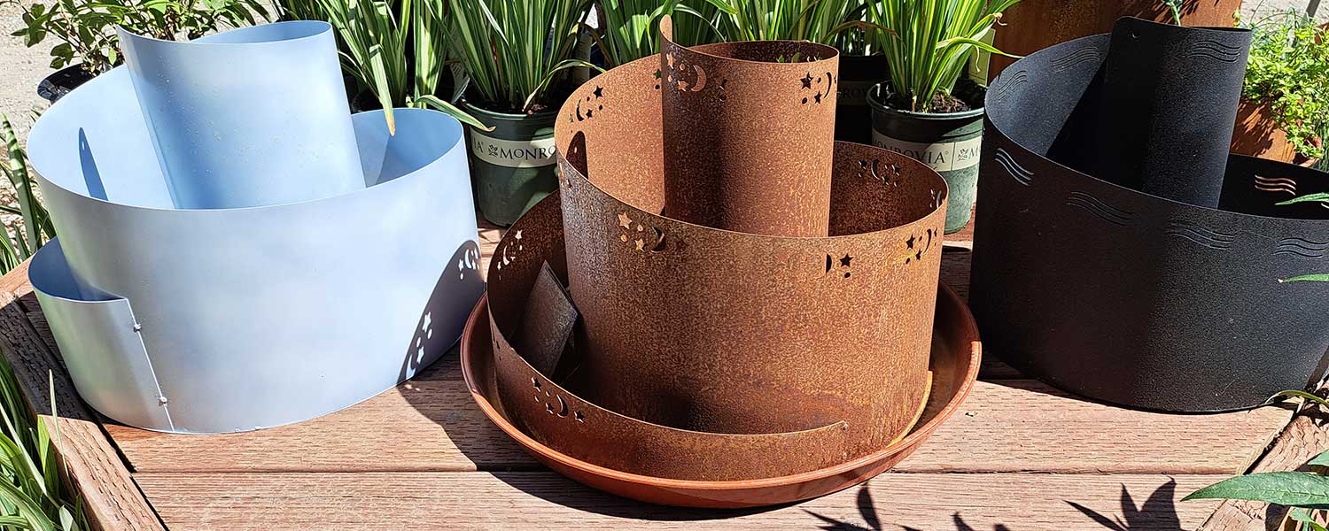 Three empty herb spirals from Spiral Gardens