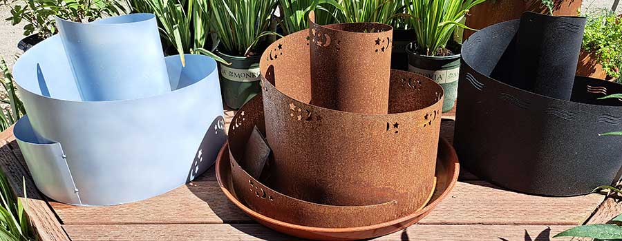three spiral planters waiting to be planted