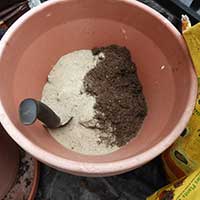 prepping soil for an herb spiral garden
