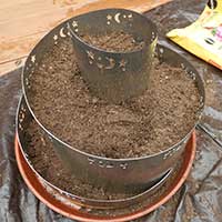 herb spiral with soil ready for planting